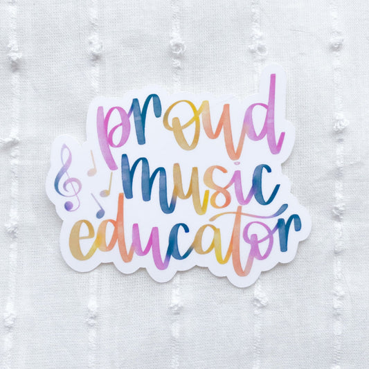 Sticker with 'proud music educator' text in colorful letters on a textured white background