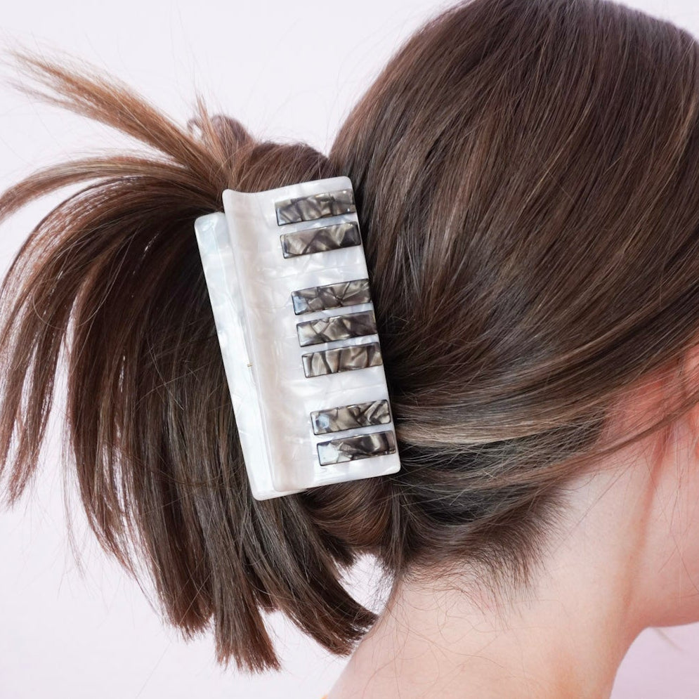 person wearing a piano hair clip