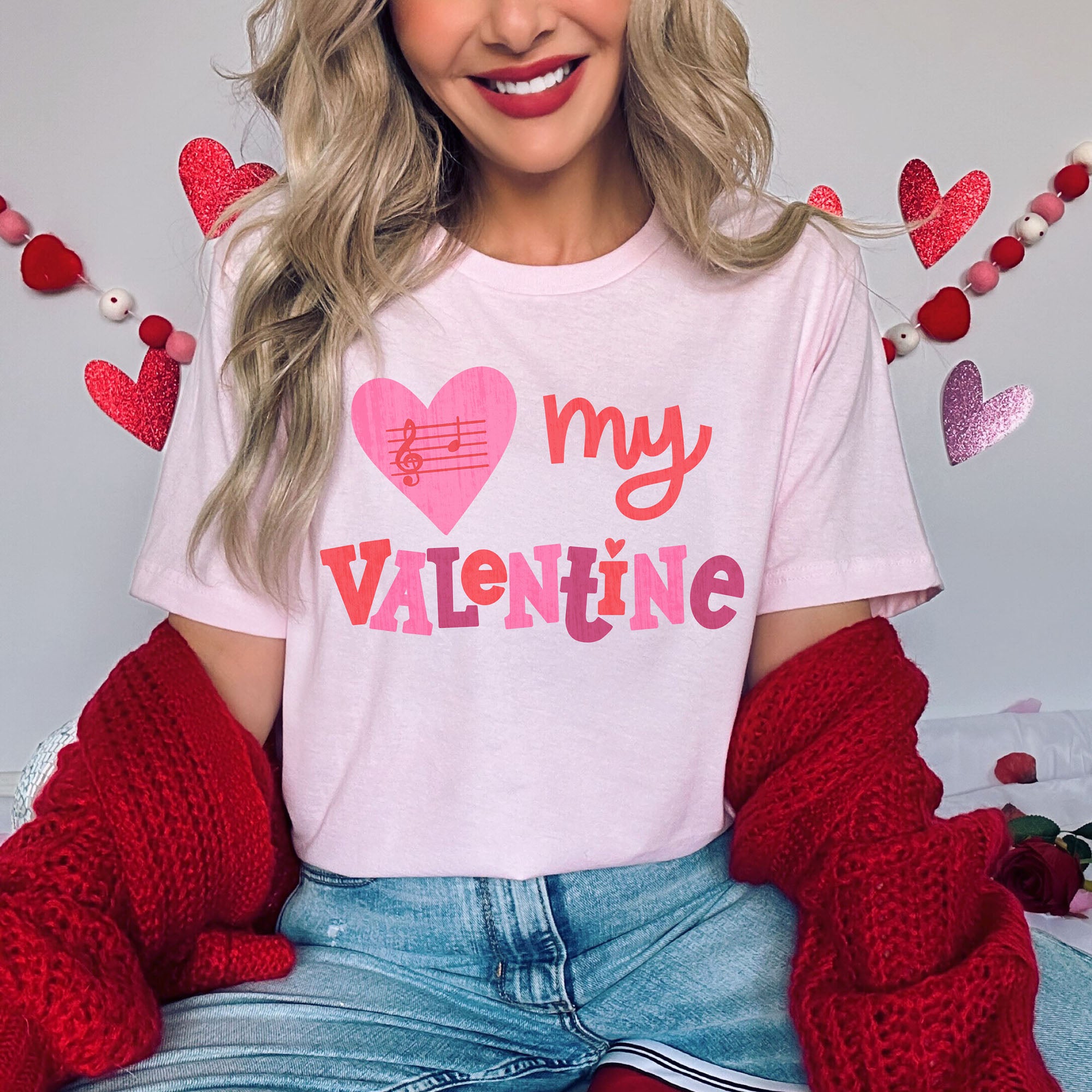woman wearing a music inspired Valentine's music teacher pink shirt that says B My Valentine.