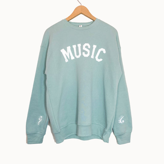 Music Crewneck Sweatshirt with a treble clef and bass clef printed on the wrists