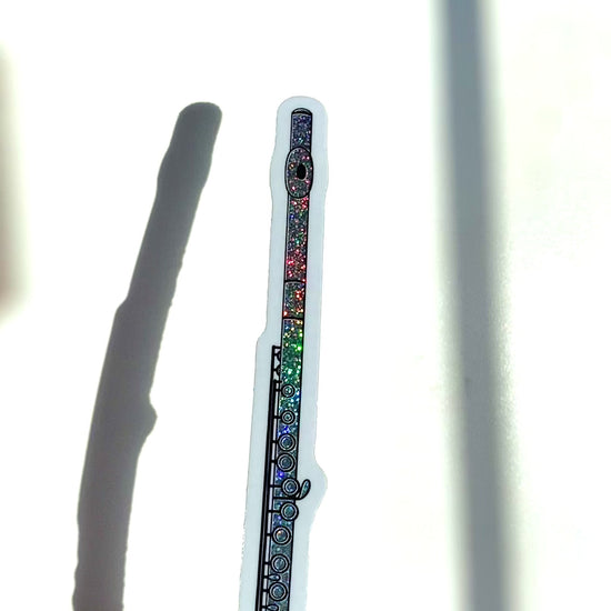 a video of a flute sticker sparkling in the sunlight