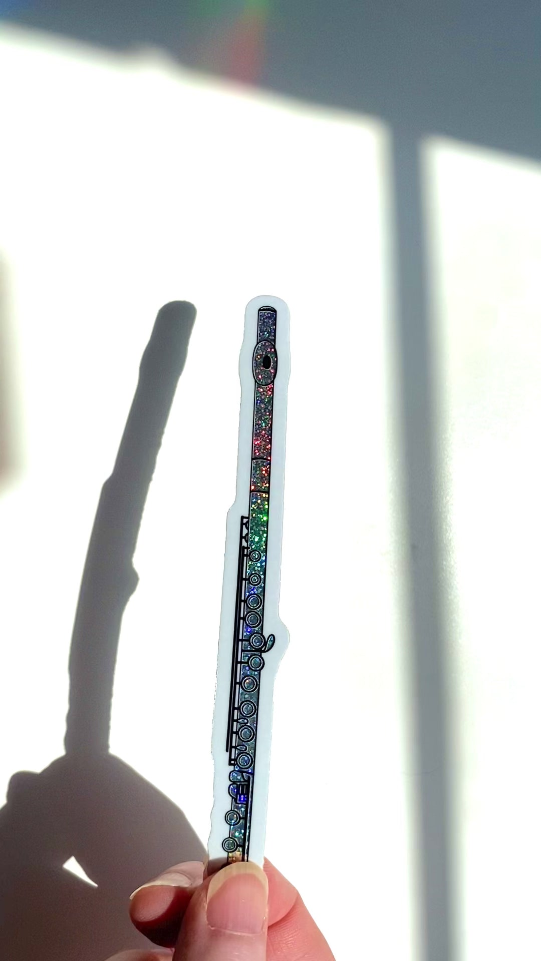 a video of a flute sticker sparkling in the sunlight